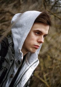 Picture Of A Boy Looking Out Over A Field Representing An Lgbt Teen